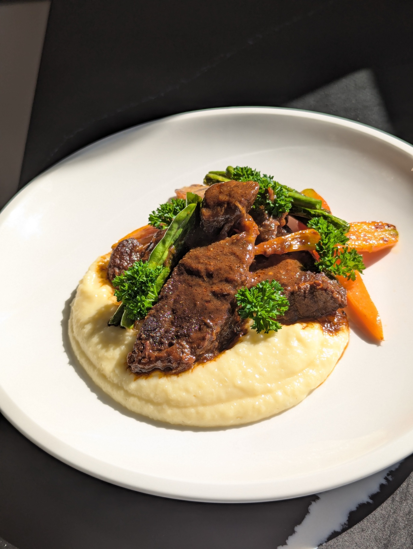 Slow-braised beef in red wine jus on cauliflower purée
