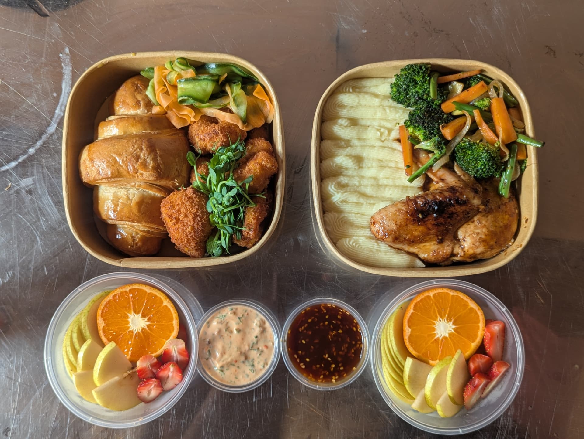 Delivered meal boxes with chicken, mash, vegetables, fruit and dips