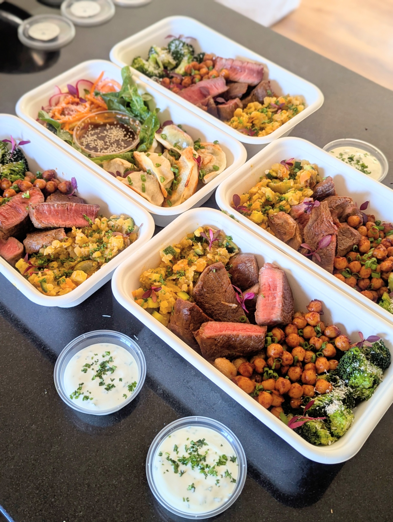 Premium packed bowls with steak, chickpeas and grain salad