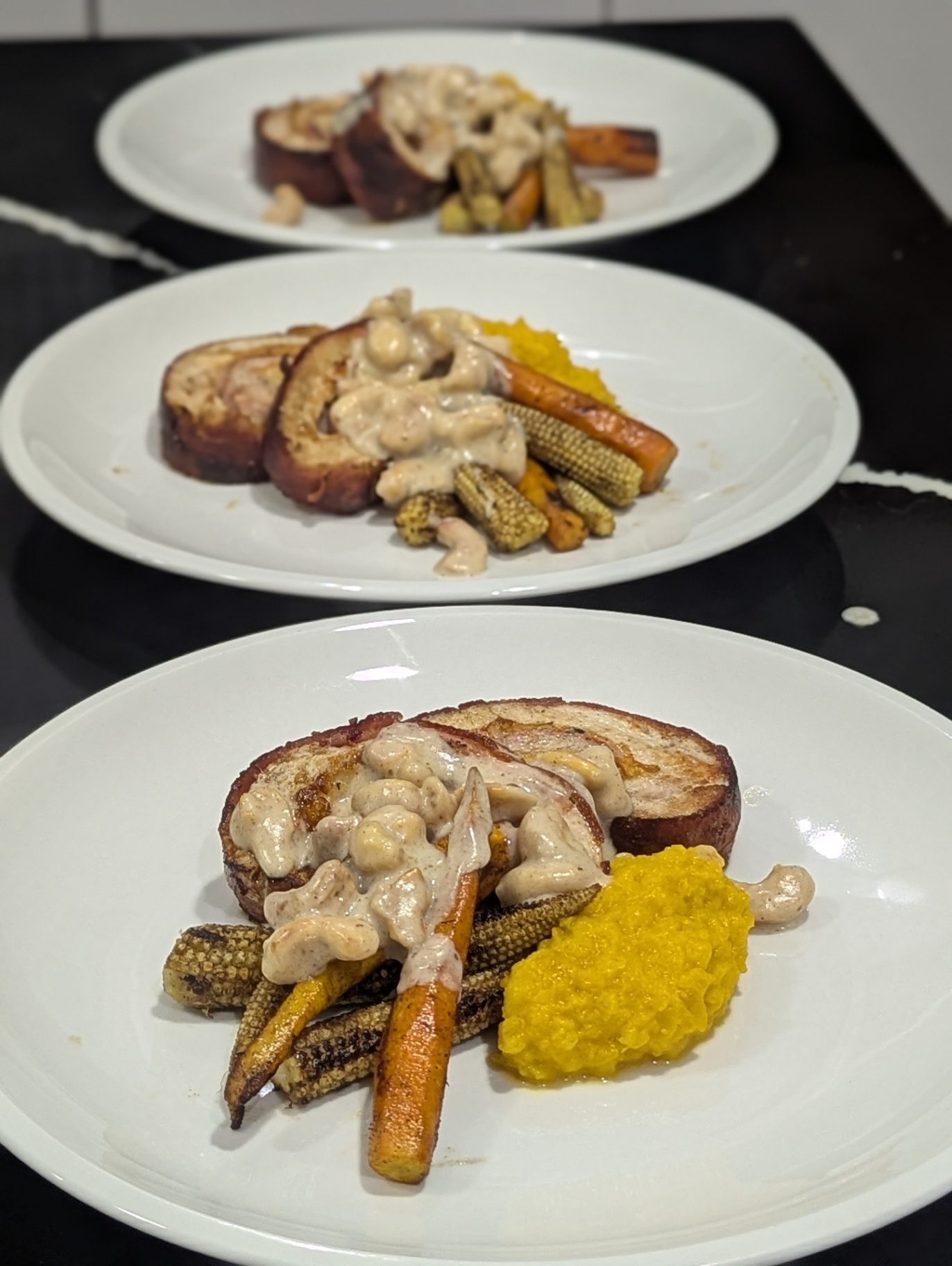 Three-plate seated dinner service with creamy cashew sauce