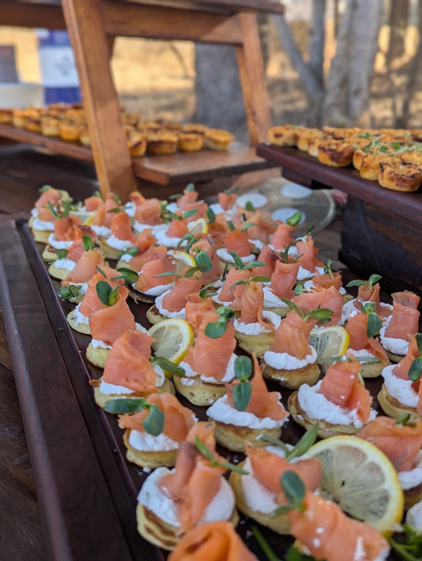 Smoked salmon blinis with cream cheese, lemon and micro herbs